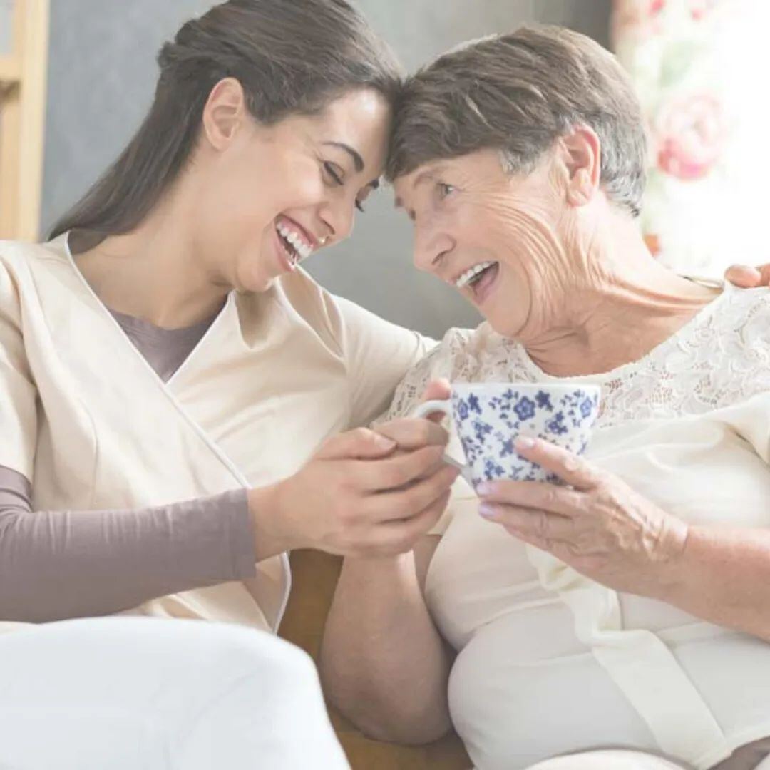 Caregiver sharing tea and conversation